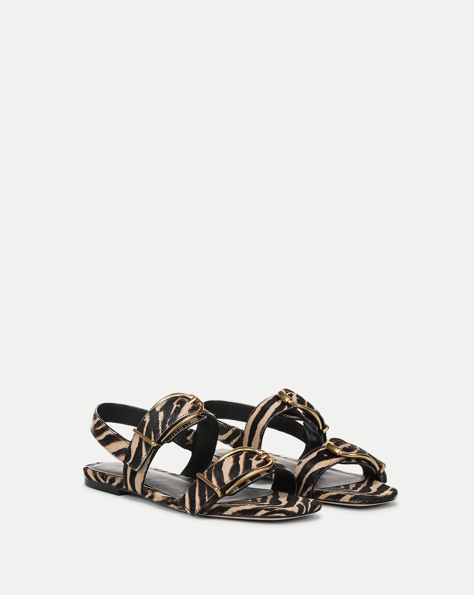 Veronica Beard Zebra print flat sandals with gold buckles
