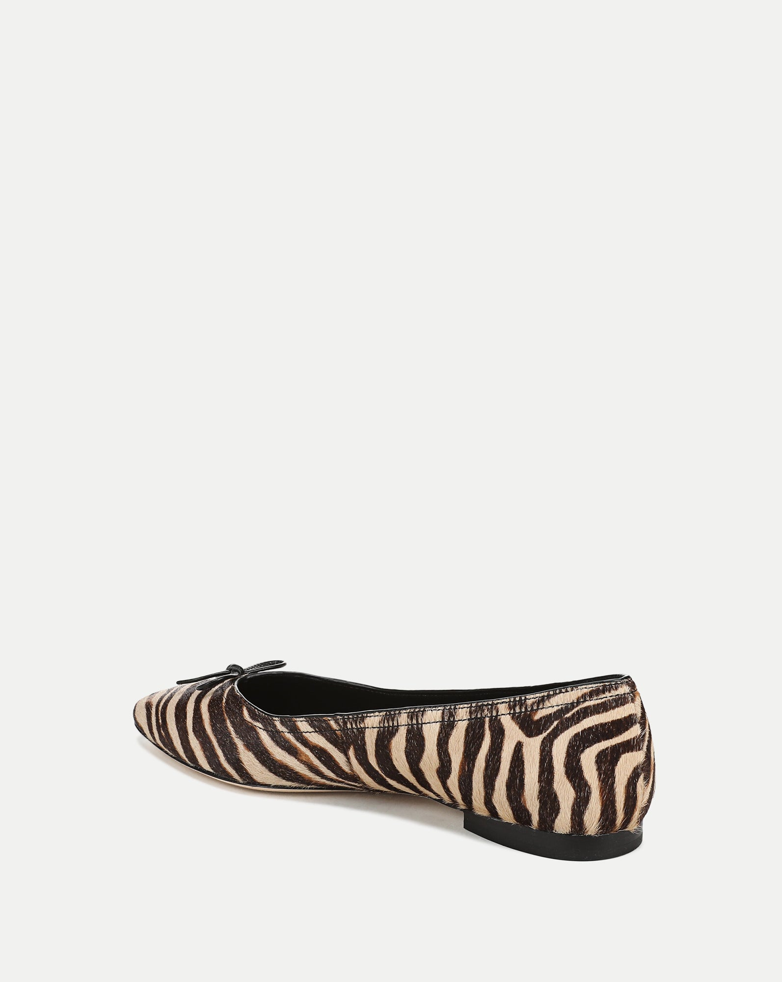 Veronica Beard Zebra print ballet flats with small bow detail.