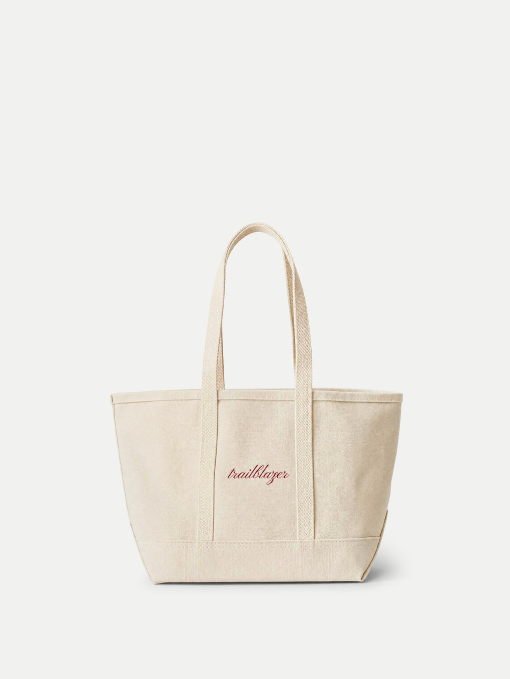 Veronica Beard Beige canvas tote bag with red script embroidery.