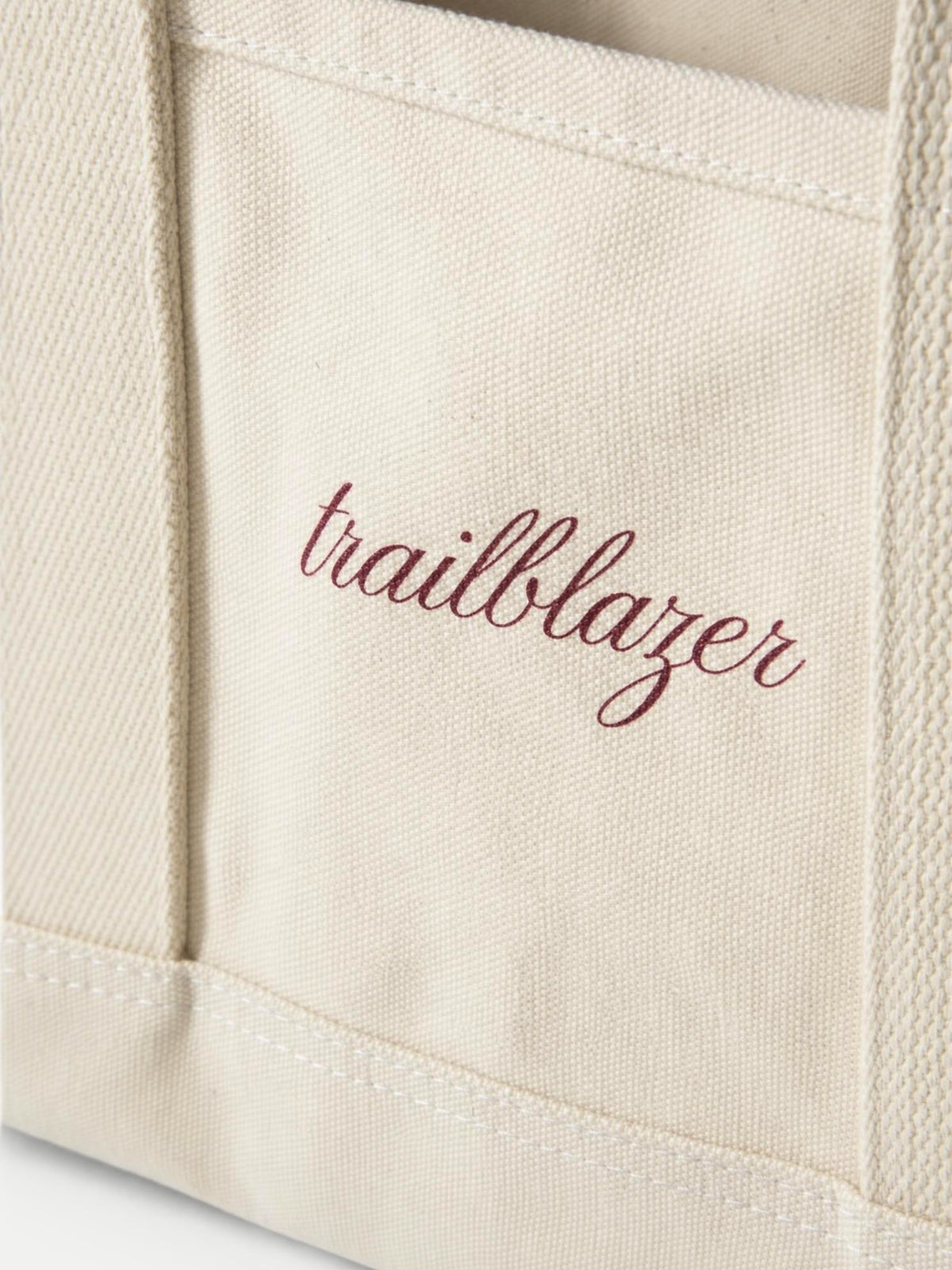 Veronica Beard Beige canvas tote bag with maroon trailblazer text.