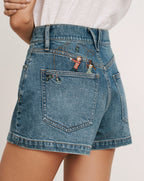 Veronica Beard Blue denim shorts with embroidered figures on the
