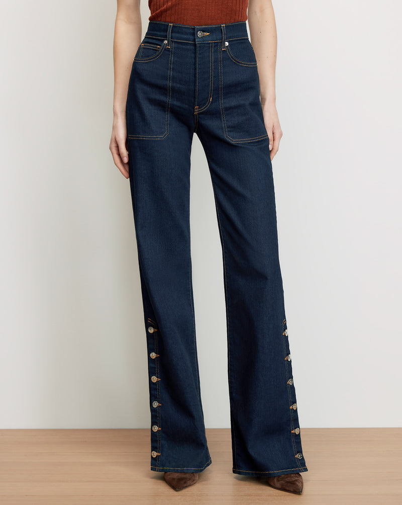 Veronica Beard Dark wash denim wide-leg jeans with side buttons.