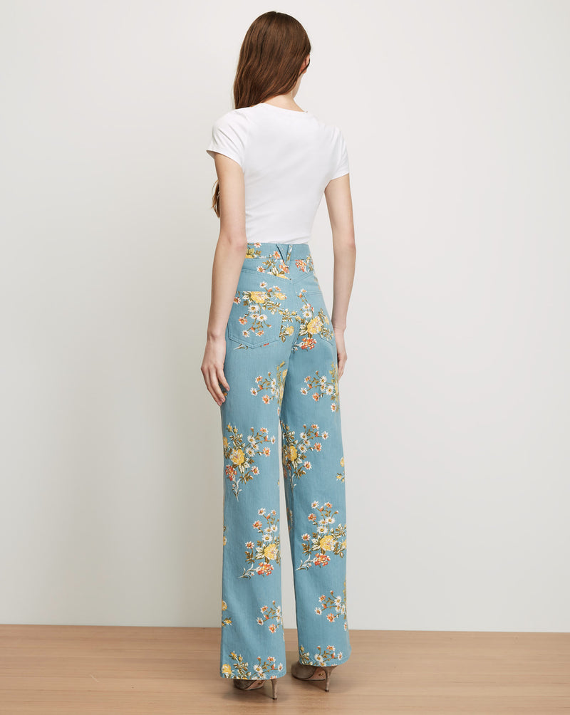 Veronica Beard White short-sleeve t-shirt and blue floral wide-leg pants.