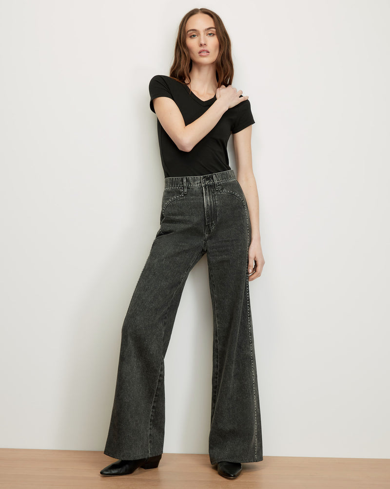 Veronica Beard Black t-shirt and dark gray wide-leg jeans with
