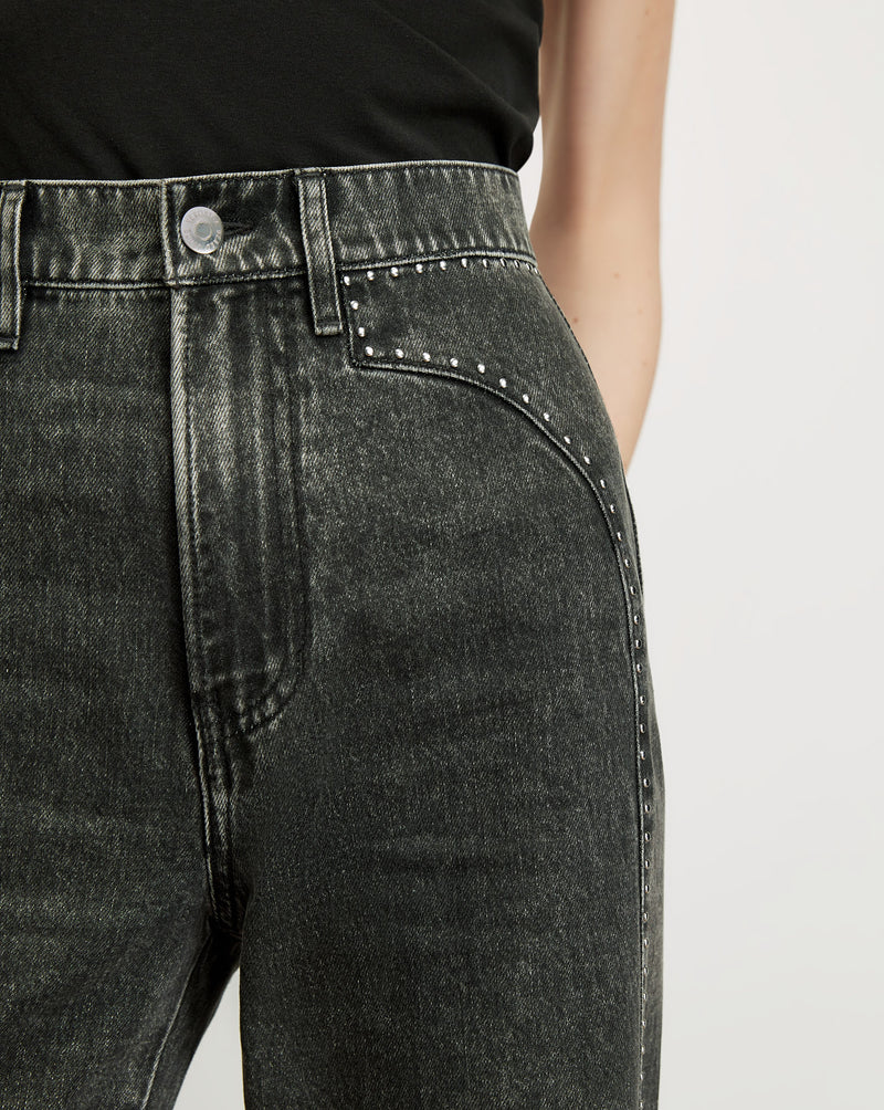 Veronica Beard Black acid wash jeans with silver studding.