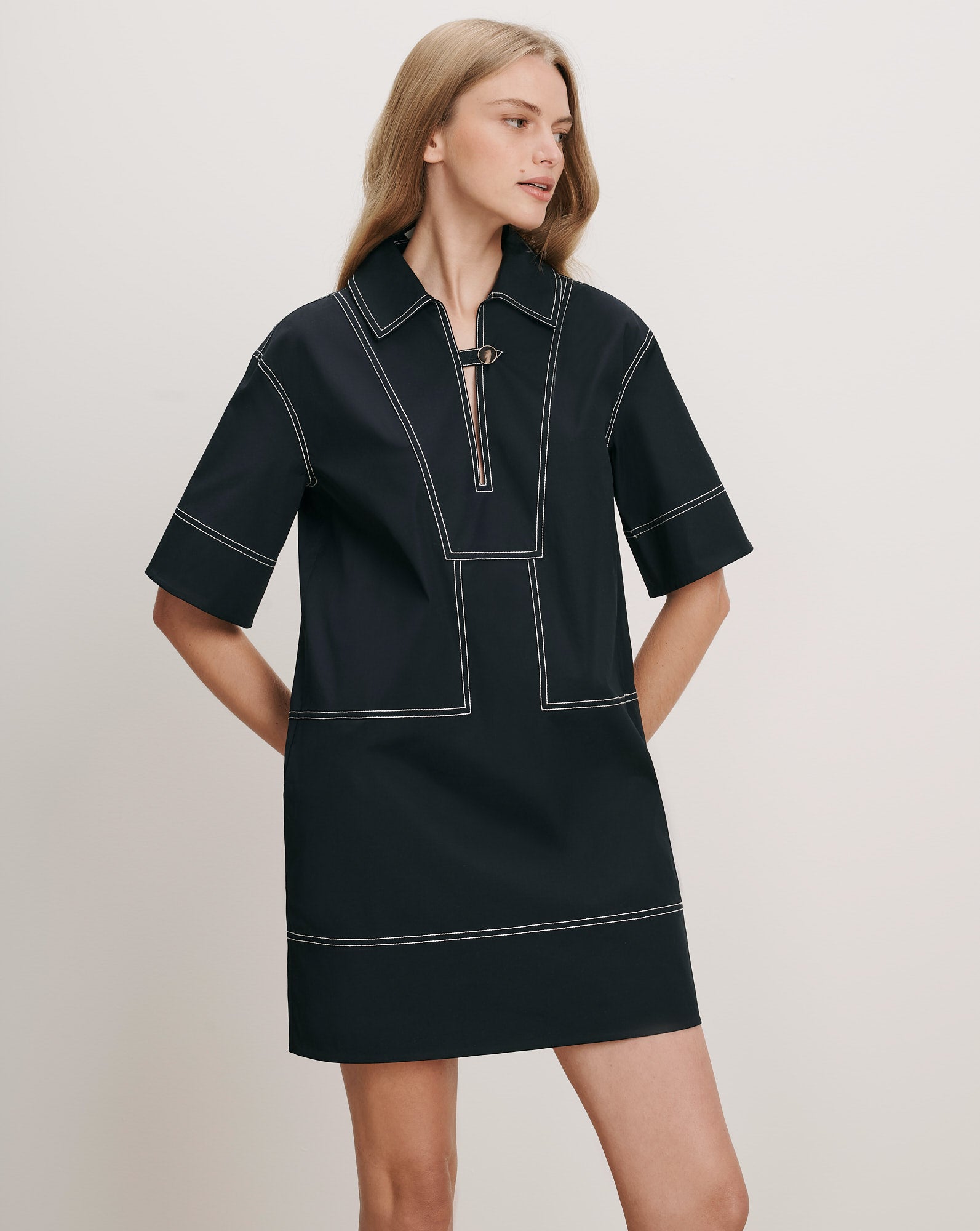 Veronica Beard Black cotton polo dress with white contrast stitching.