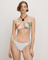 Veronica Beard White bikini with tropical print and side-tie bottoms.