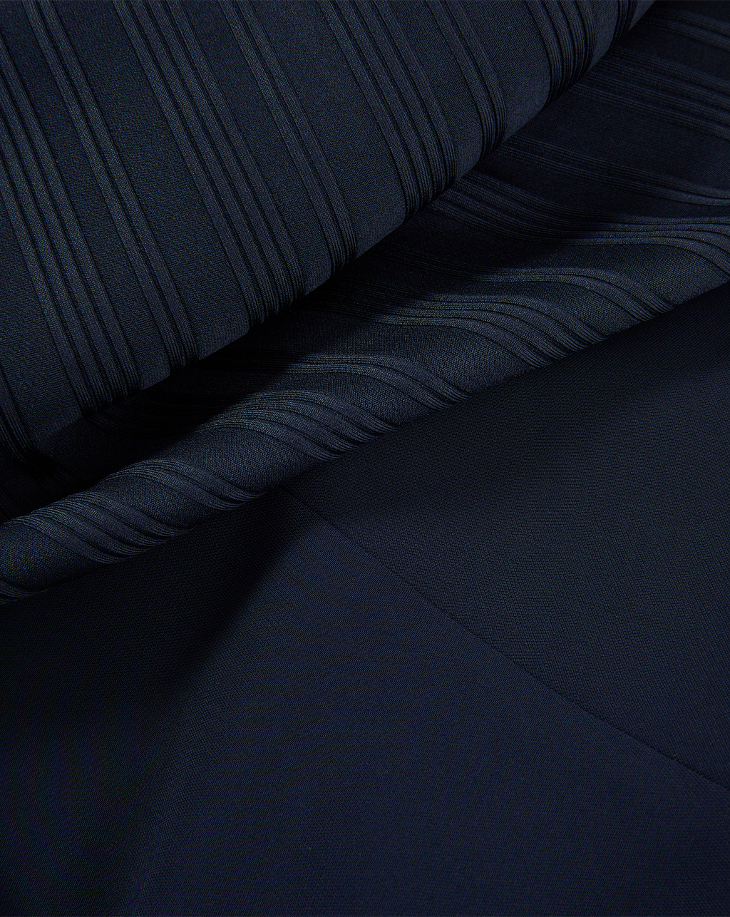 Veronica Beard Navy blue ribbed knit fabric with a smooth section.