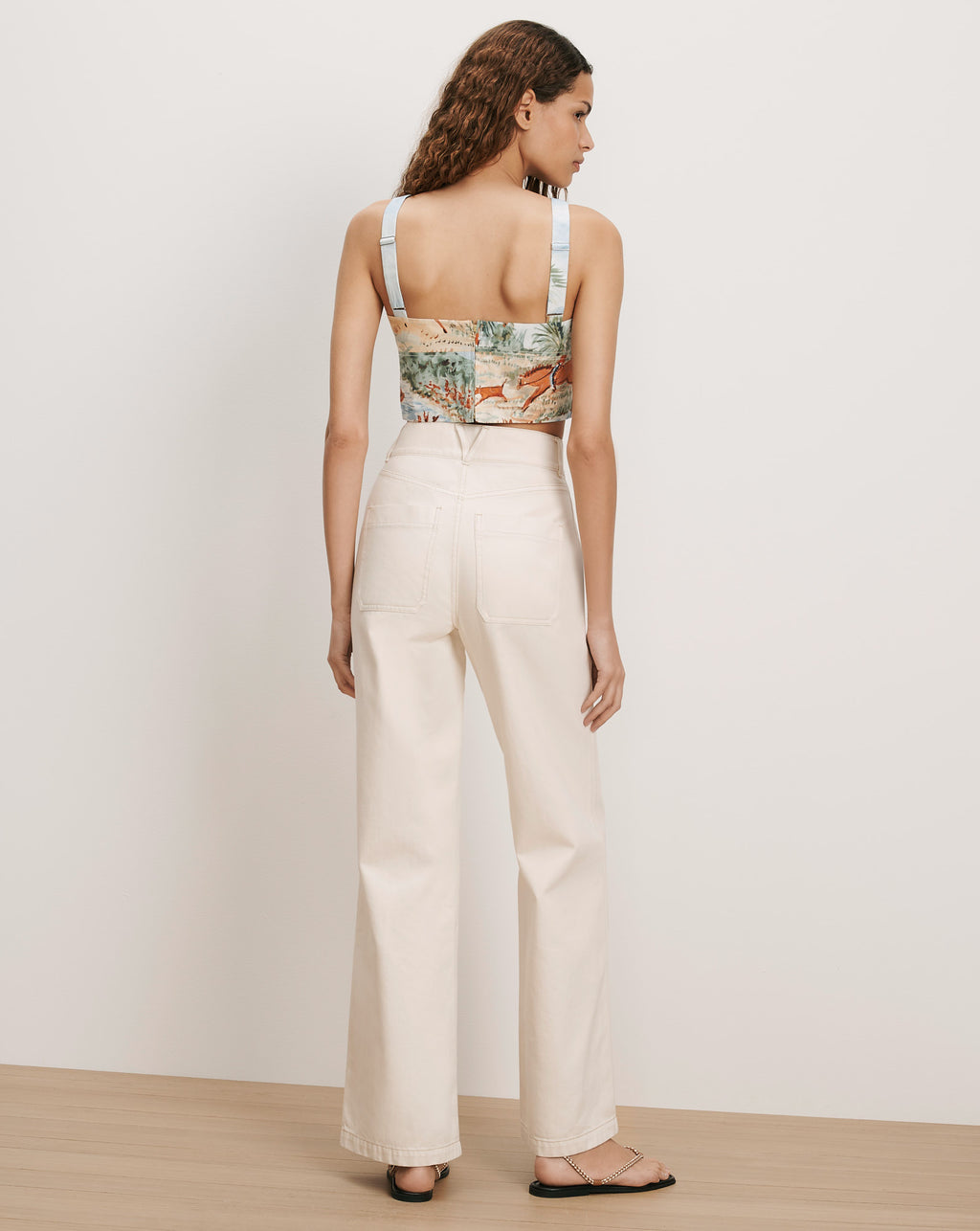 Veronica Beard Cream wide-leg jeans and a printed camisole.