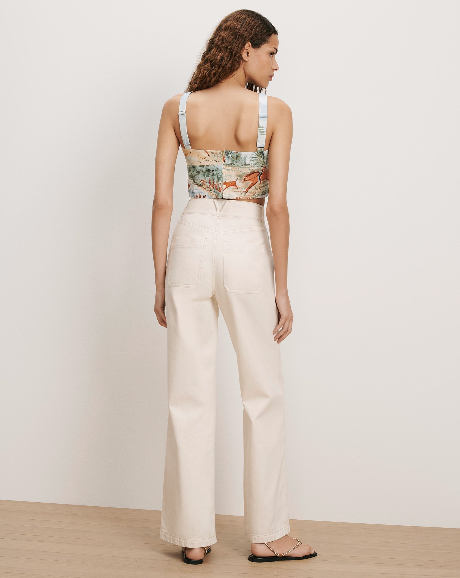 Veronica Beard Cream wide-leg jeans and a printed camisole.